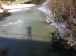 bridge over thawing creek