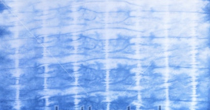 stock-photo-cotton-fabric-tie-dyed-using-indigo-blue-dye-424833586 - Version 2